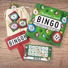 This is the image of "Colorful bingo cards with numbered balls and a player marking a winning combination.