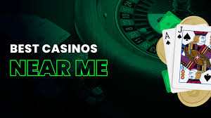 This is the image for Online casino near me. A Mobile phone showing online casino game with live dealer and slot machine.